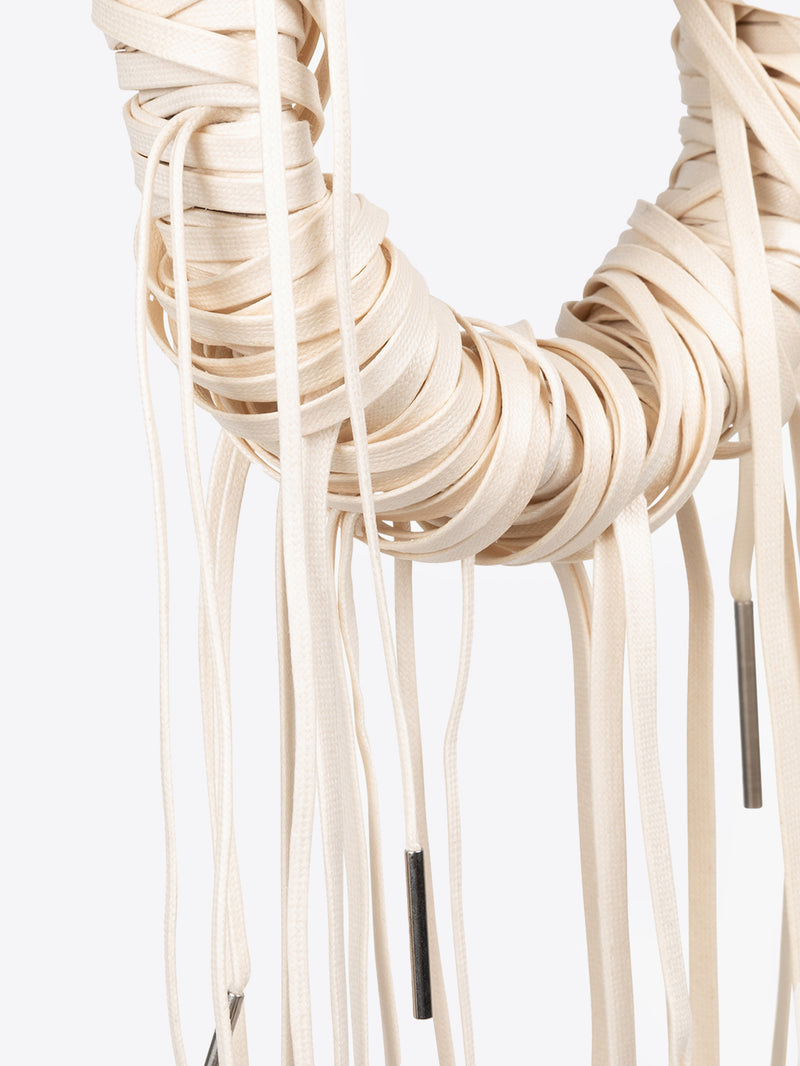 Necklace with long hanging elements on a white background