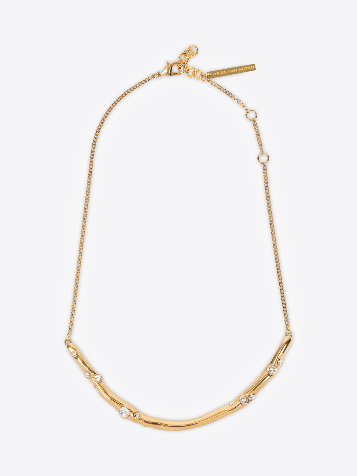 Gold necklace with small pearls on a white background