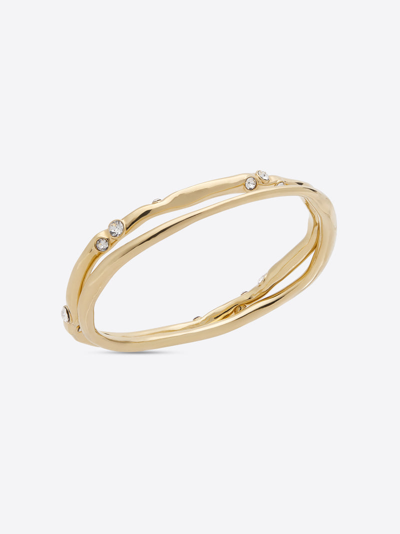 Gold bracelet with small stones on a white background