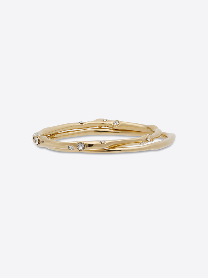 Gold bracelet with small stones on a white background