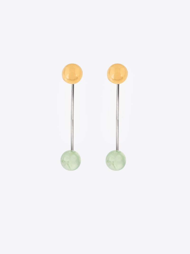 Pair of earrings with gold and green beads on a white background