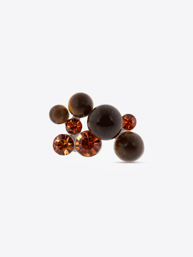 Brown and orange gemstones on a white background