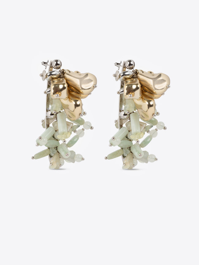 Gold and green earrings on a white background