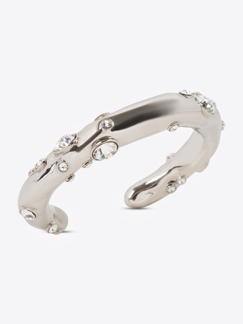 Silver ring with embedded stones on a white background