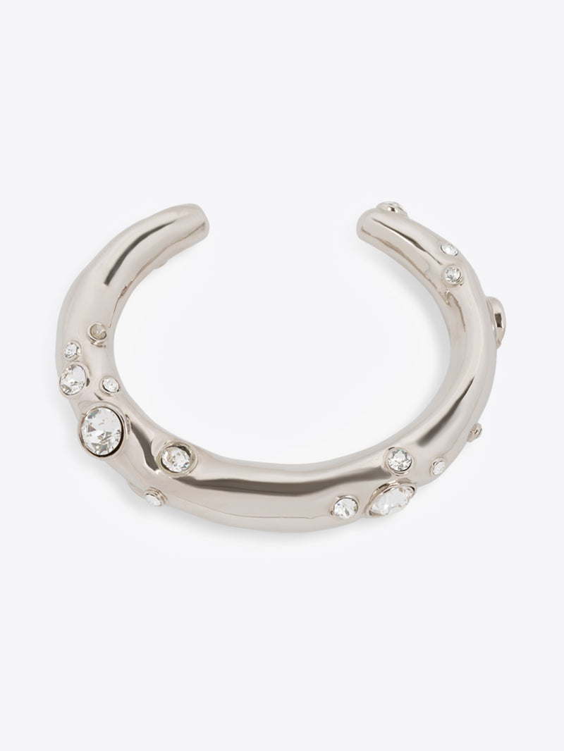 Silver horseshoe-shaped bracelet with embedded crystals on a white background