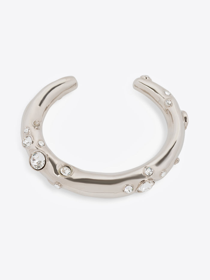 Silver horseshoe-shaped bracelet with embedded crystals on a white background