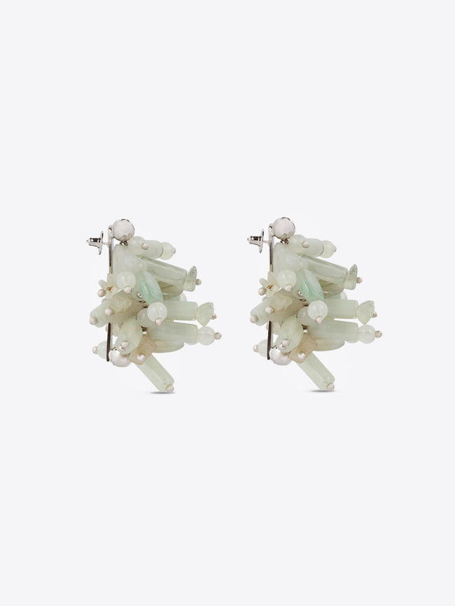 Pair of earrings with light green and white stones on a white background