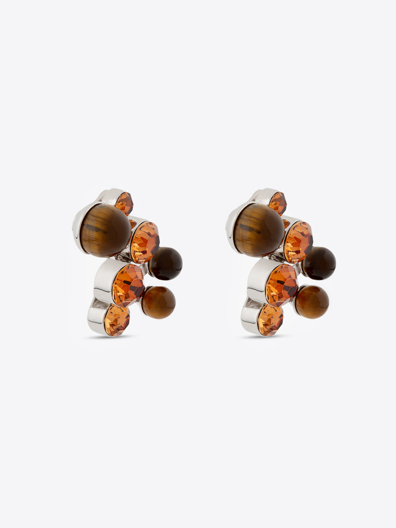 Pair of earrings with amber stones on a white background