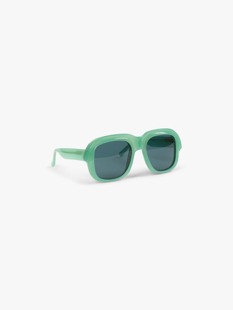 Green sunglasses on a white background