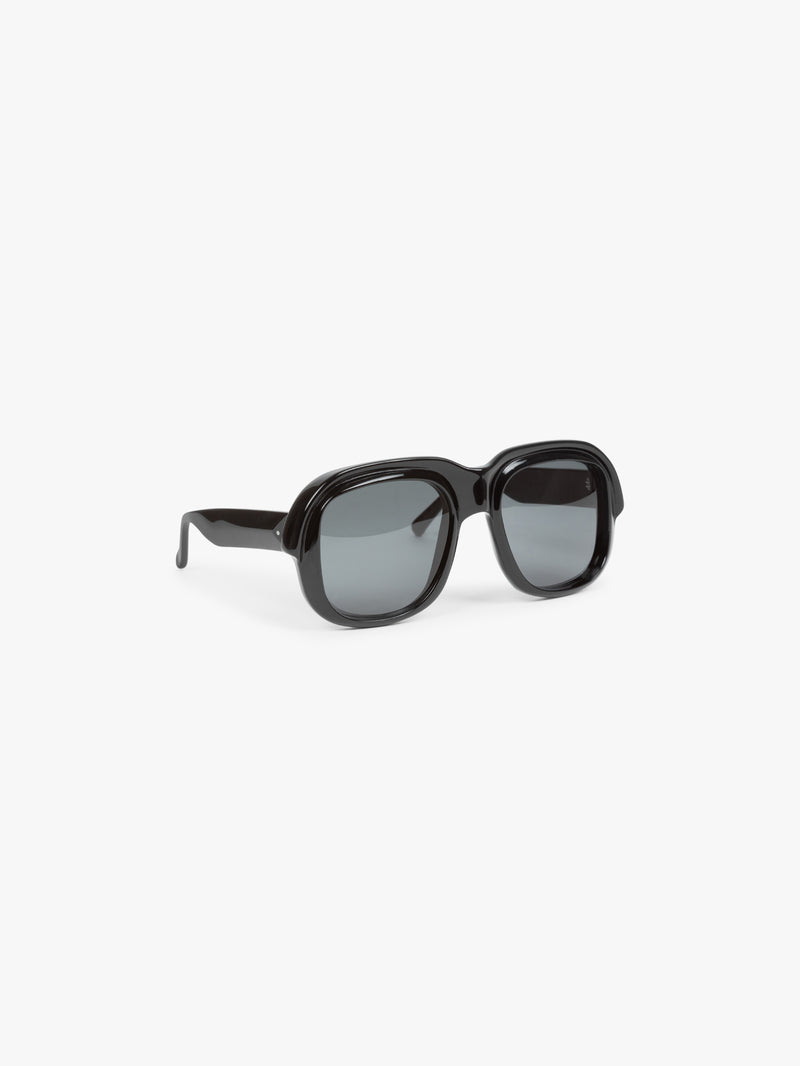 Black sunglasses with dark lenses on a white background