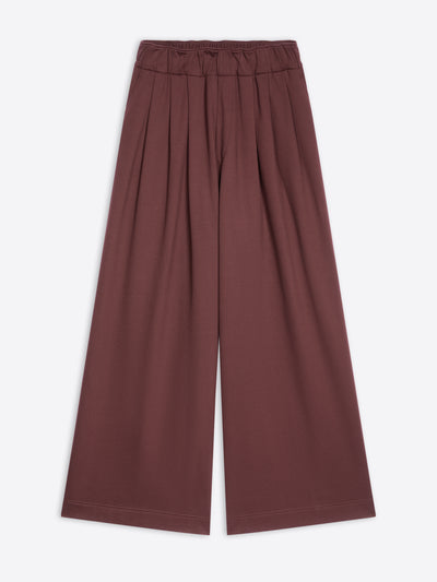 Burgundy colored, wide pleated sweatpants on a white background - Dries Van Noten