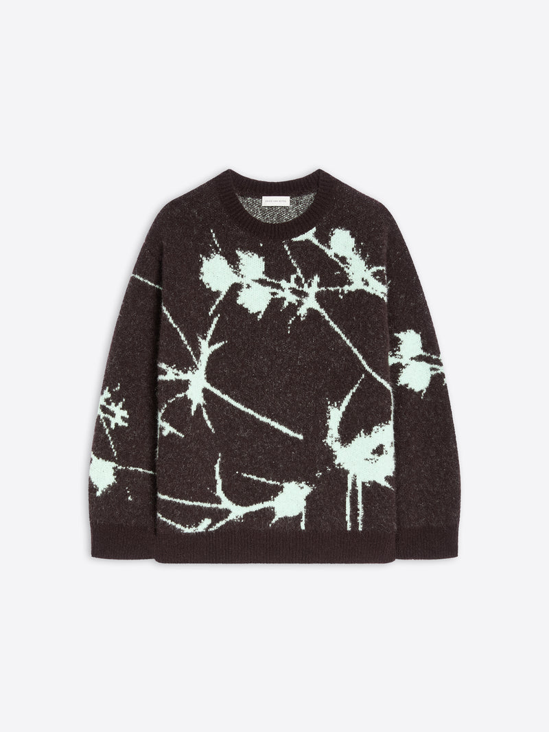 Black sweater with white abstract pattern on a light gray background