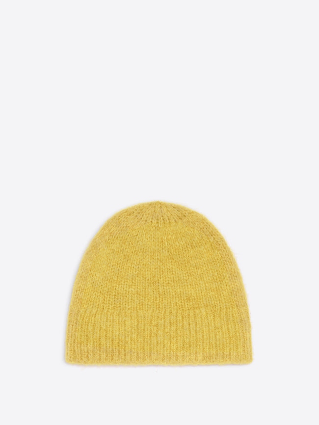Mustard colored wool beanie on a white background