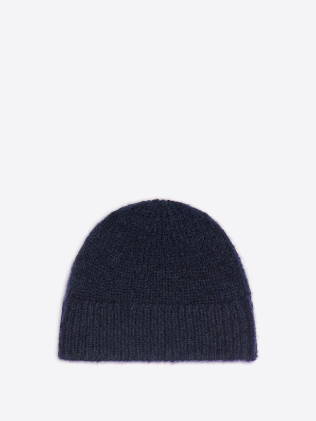 Navy colored wool beanie on a white background