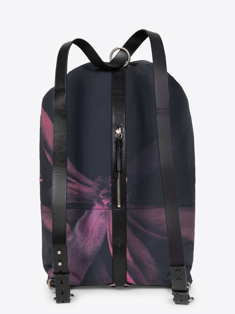 Bordeaux black duffel backpack with a floral design on a white background