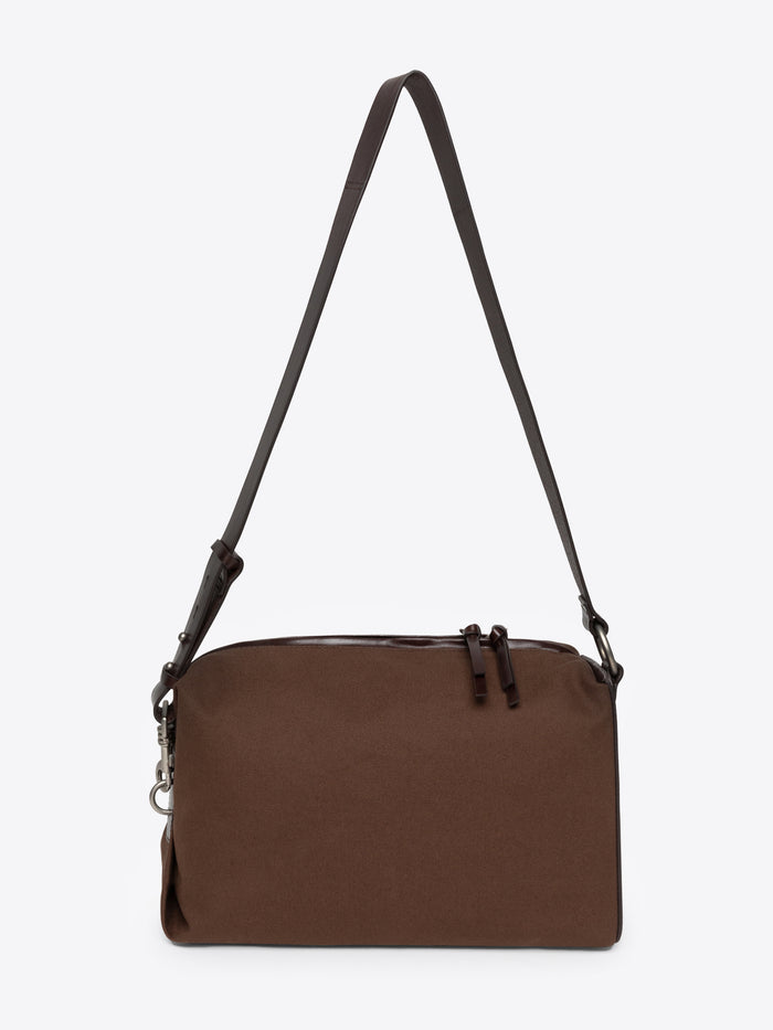 Dark brown shoulder bag with a strap on a white background