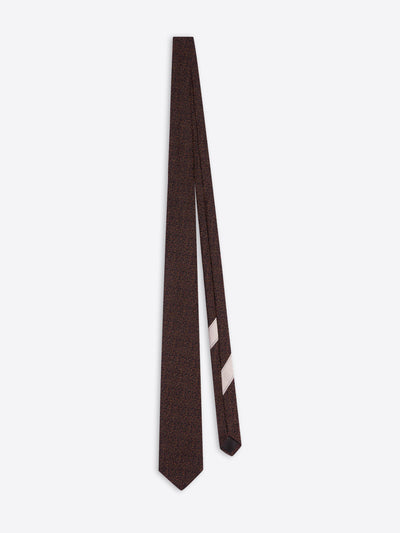 Burgundy classic wool and silk tie on a white background - Dries Van Noten
