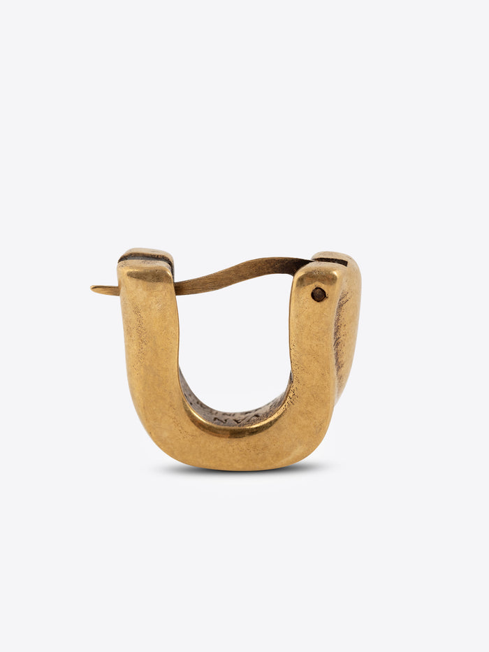 Mat gold clasp earring on a white background