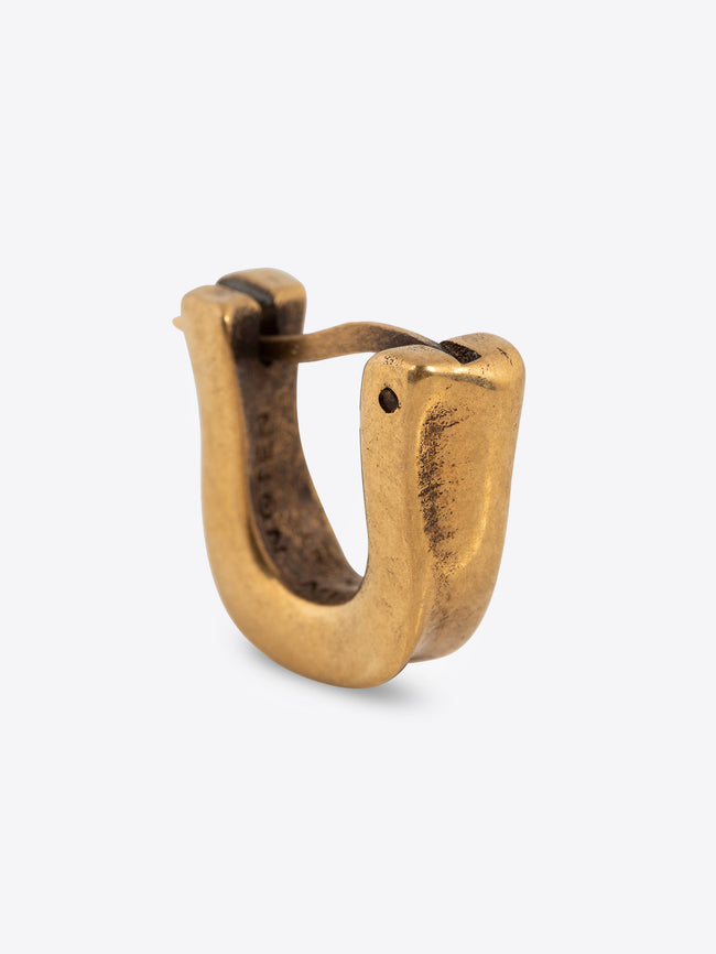 Mat gold clasp earring on a white background