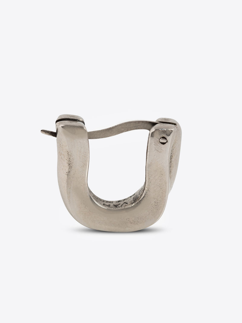 Palladium clasp earring on a white background