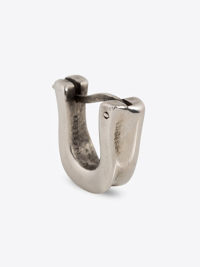 Palladium clasp earring on a white background