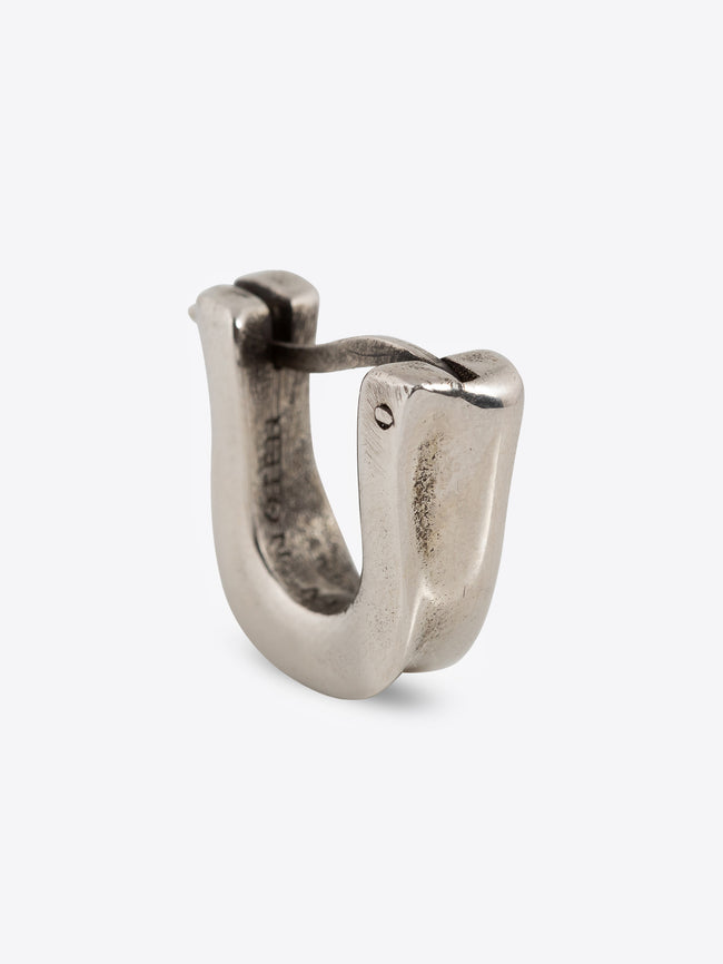 Palladium clasp earring on a white background