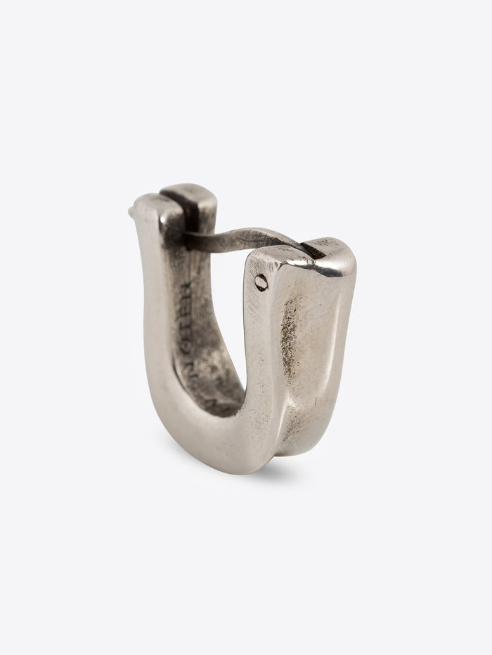 Palladium clasp earring on a white background