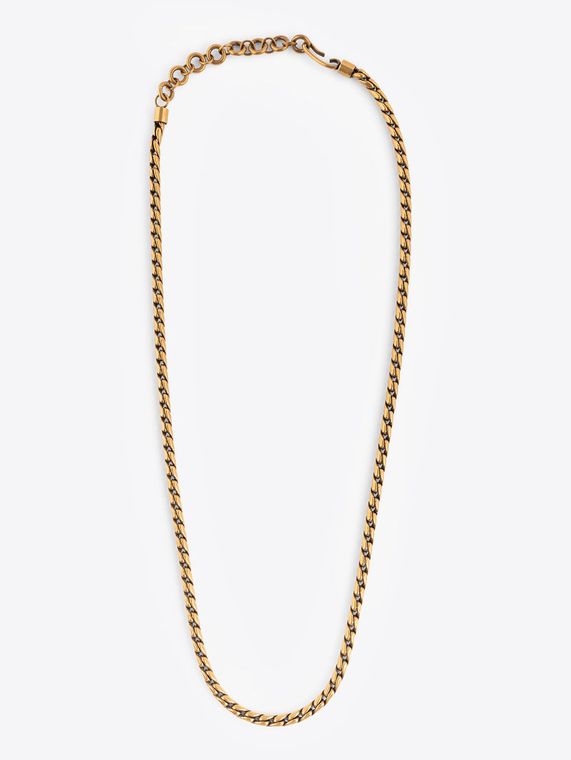 Gold colored chain belt on a white background