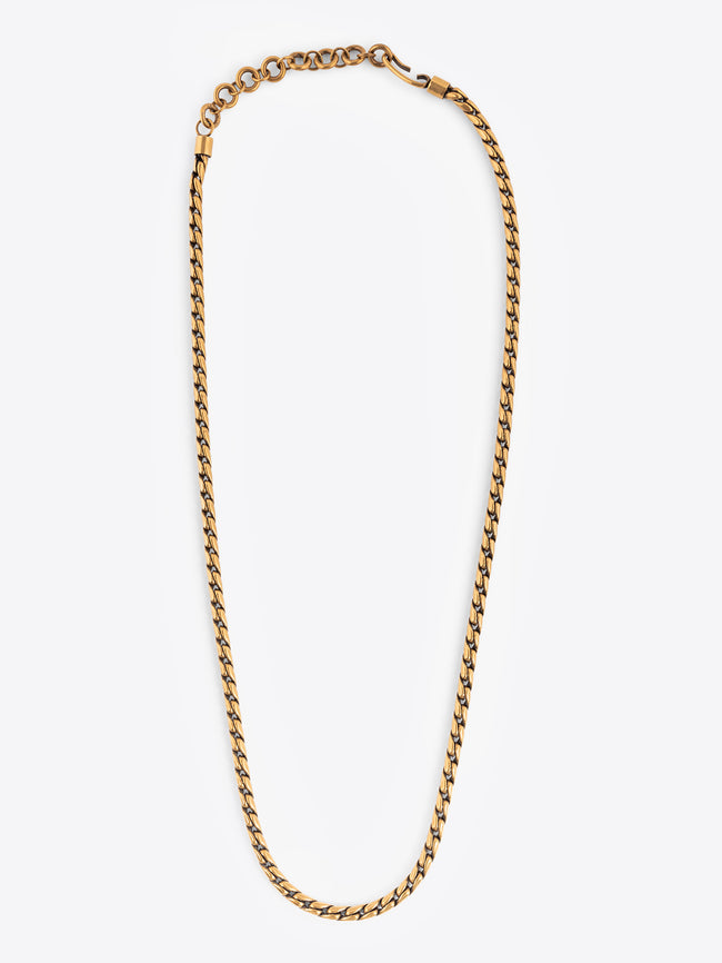 Gold colored chain belt on a white background