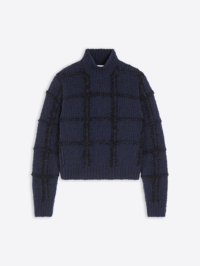 Navy blue textured sweater on a white  background
