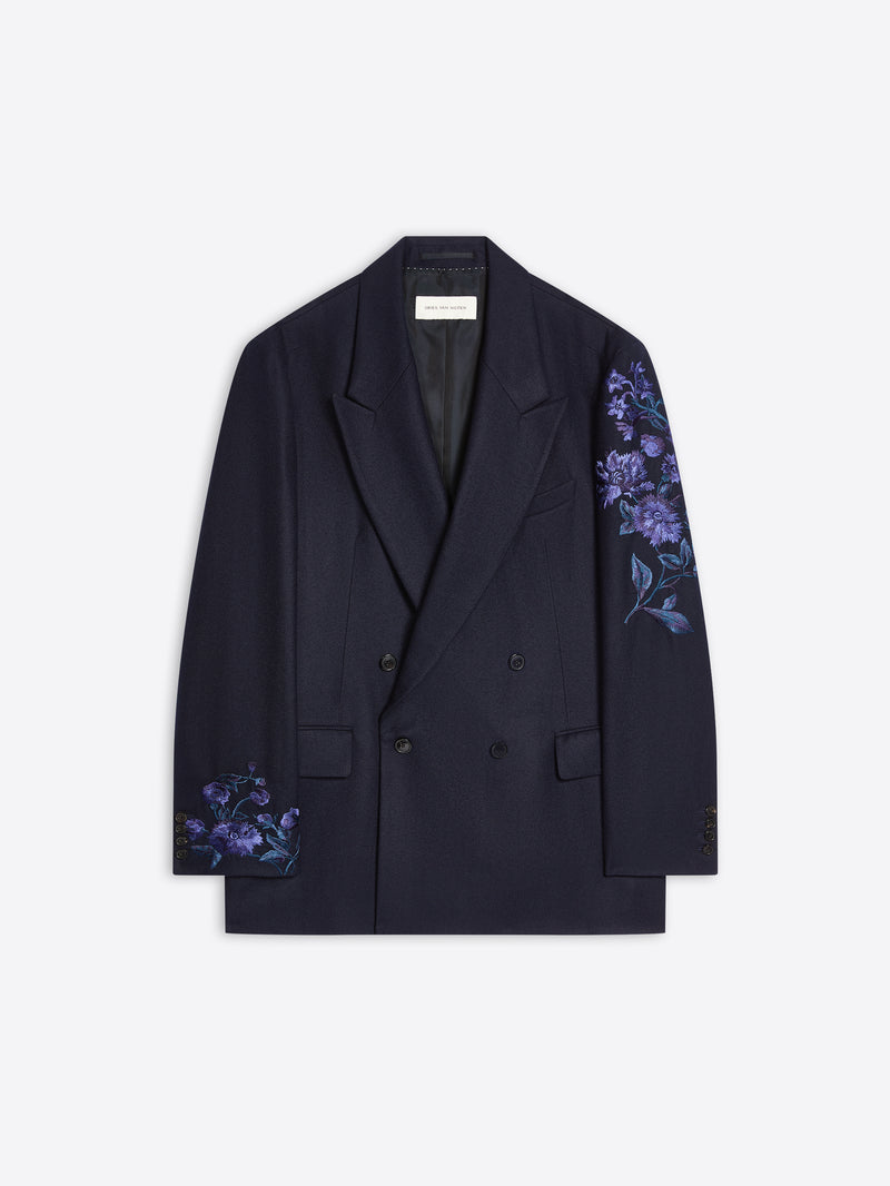 Navy colored, floral embroidered wool blazer on a white background