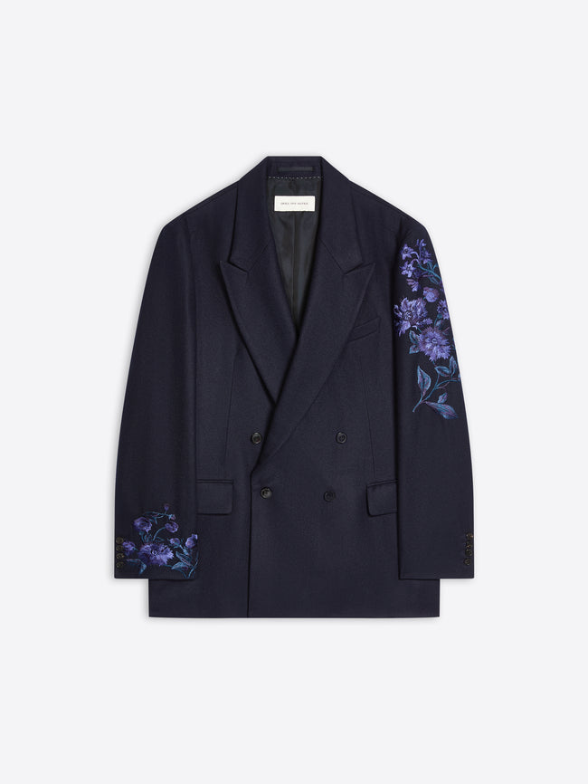Navy colored, floral embroidered wool blazer on a white background