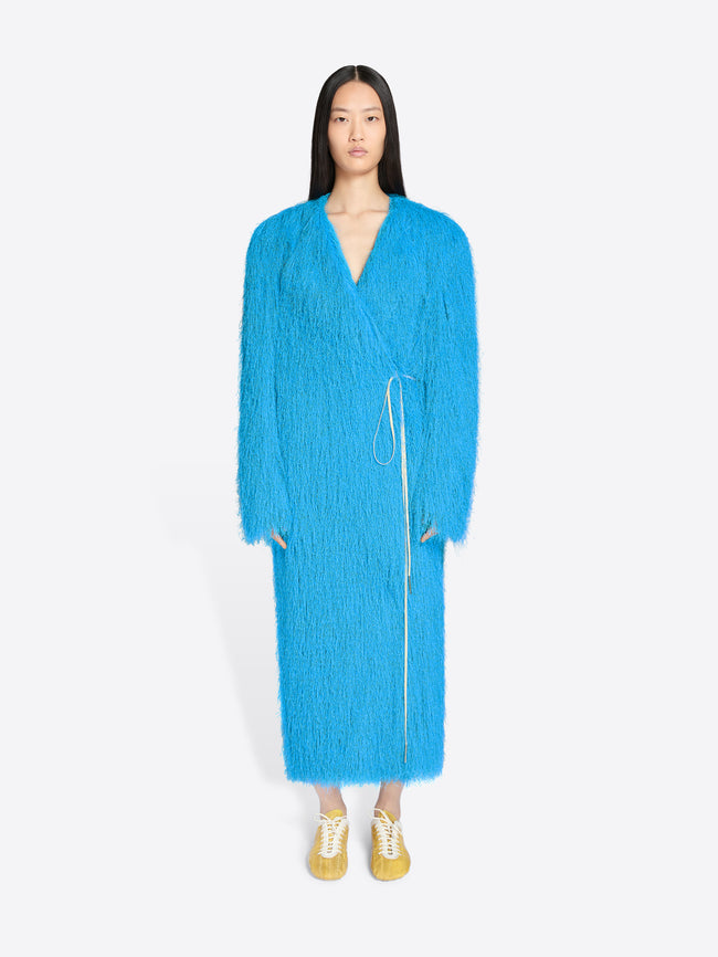 Person wearing a bright blue dress on a white background - Dries Van Noten