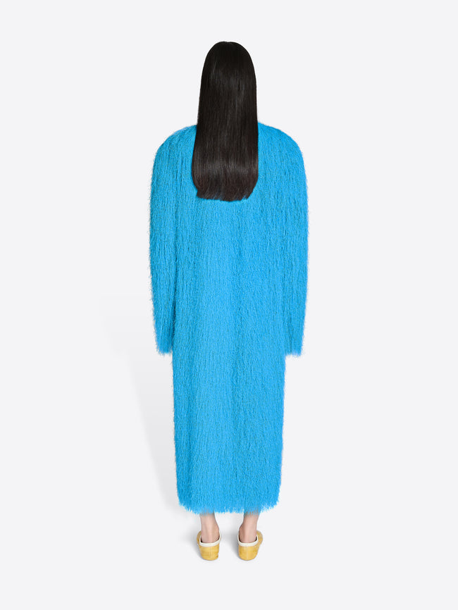 Person wearing a blue dress on a white background - Dries Van Noten