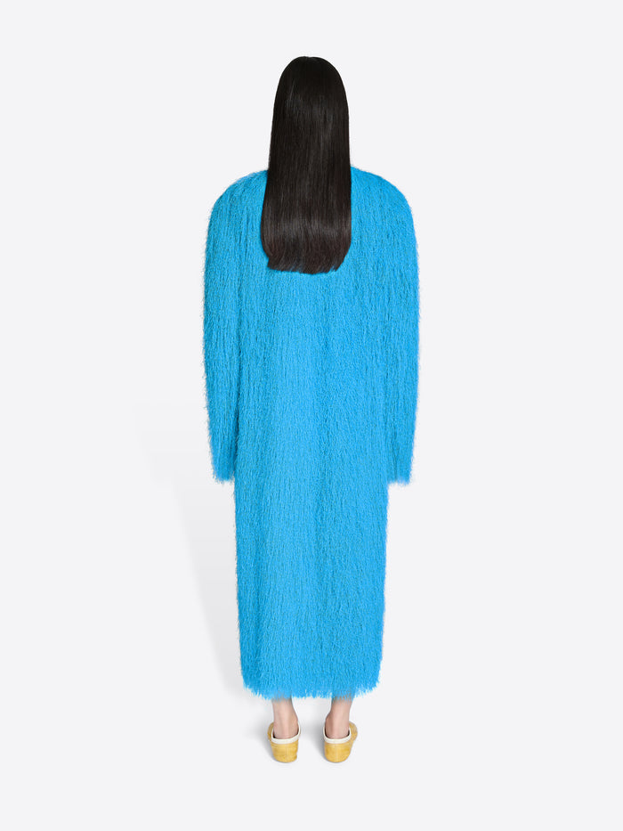 Person wearing a blue dress on a white background - Dries Van Noten