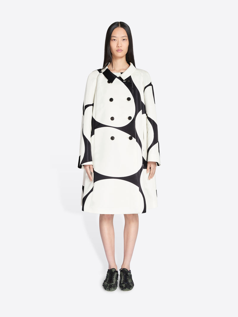Woman wearing a black and white patterned dress on a white background - Dries Van Noten