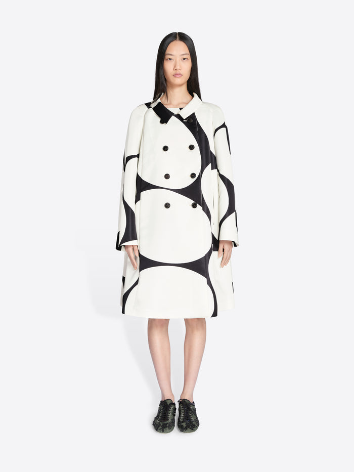 Woman wearing a black and white patterned dress on a white background - Dries Van Noten