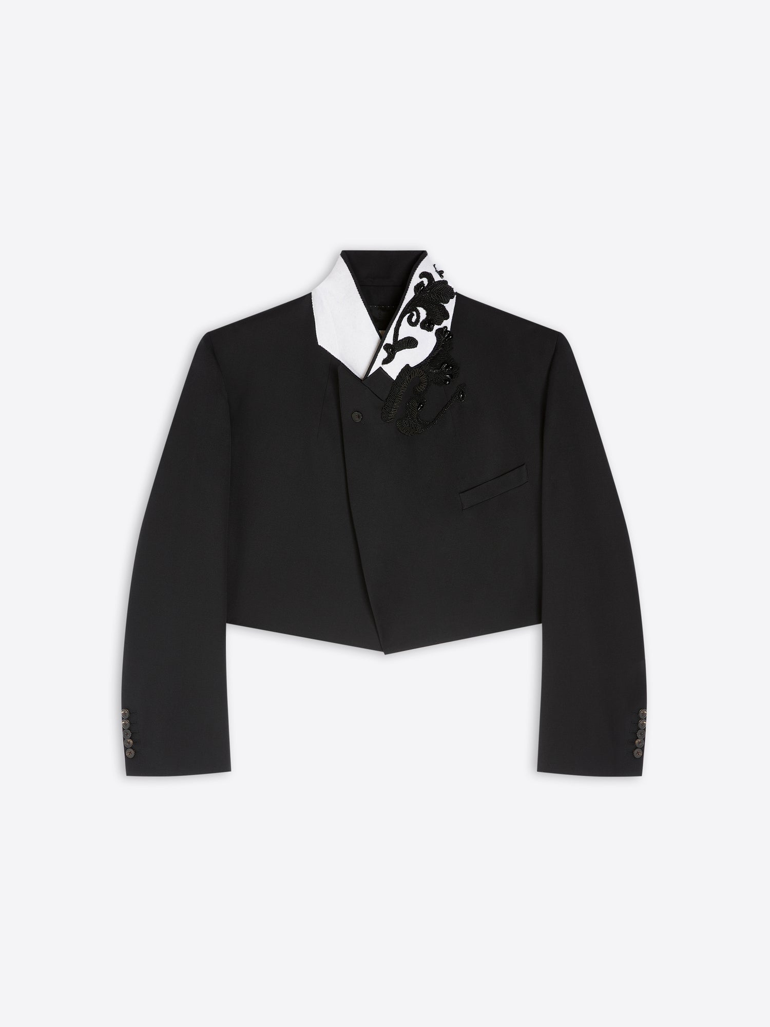 Black cropped tuxedo jacket with black and white patterned details on a light gray background - Dries Van Noten