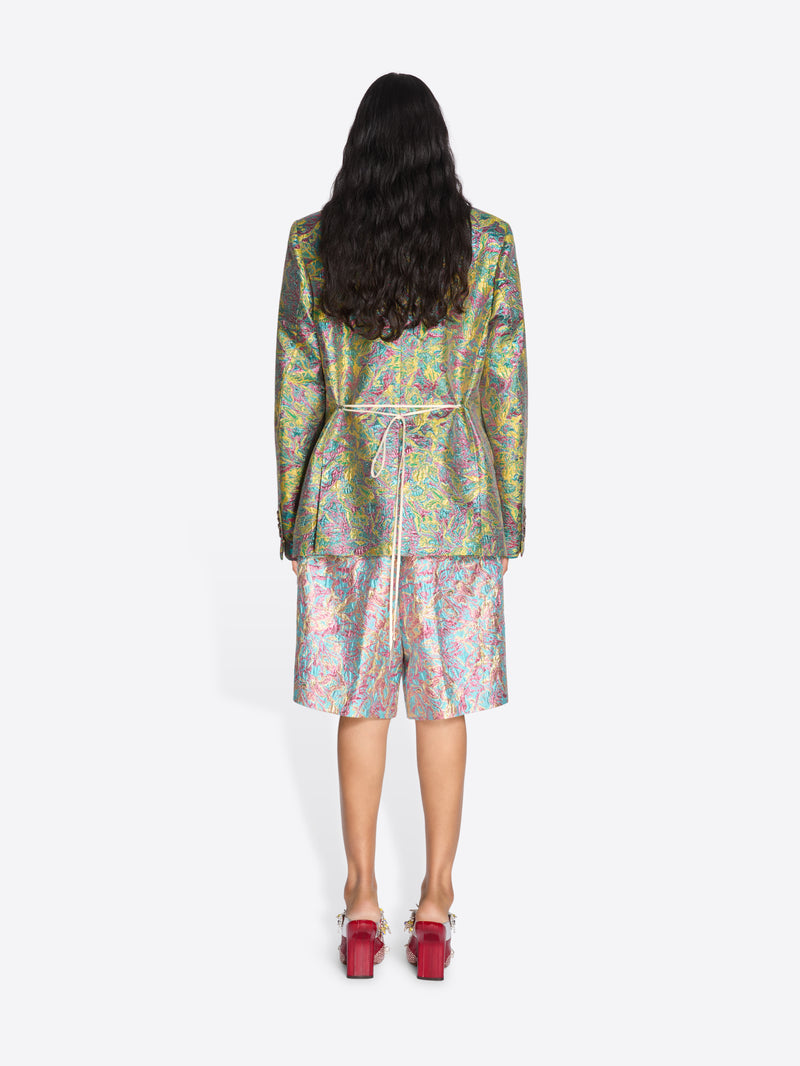 Person wearing a colorful floral outfit on a white background - Dries Van Noten