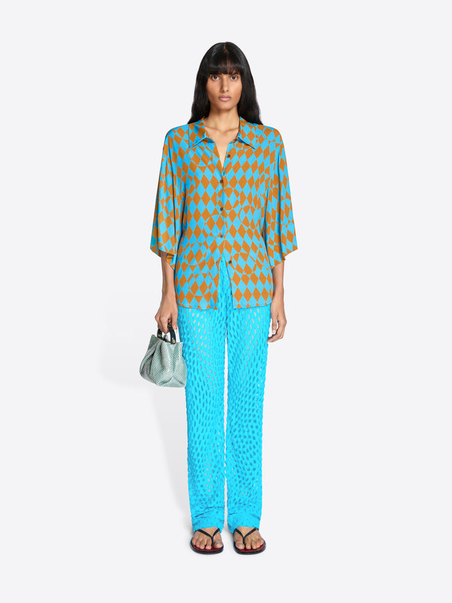 Woman wearing a patterned outfit with a white background - Dries Van Noten