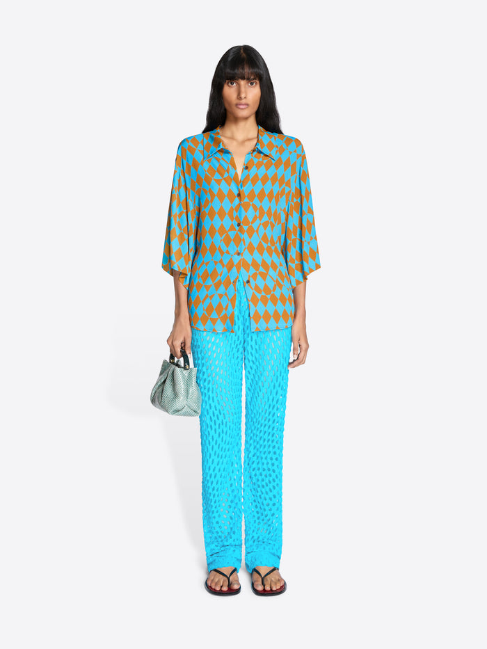 Woman wearing a patterned outfit with a white background - Dries Van Noten