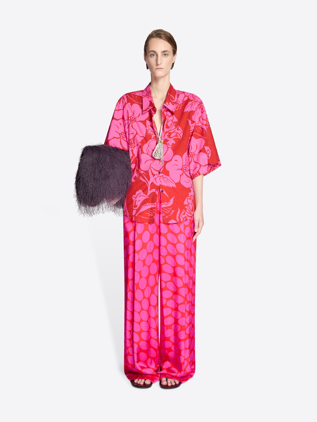 Woman wearing a pink floral set with a white background - Dries Van Noten