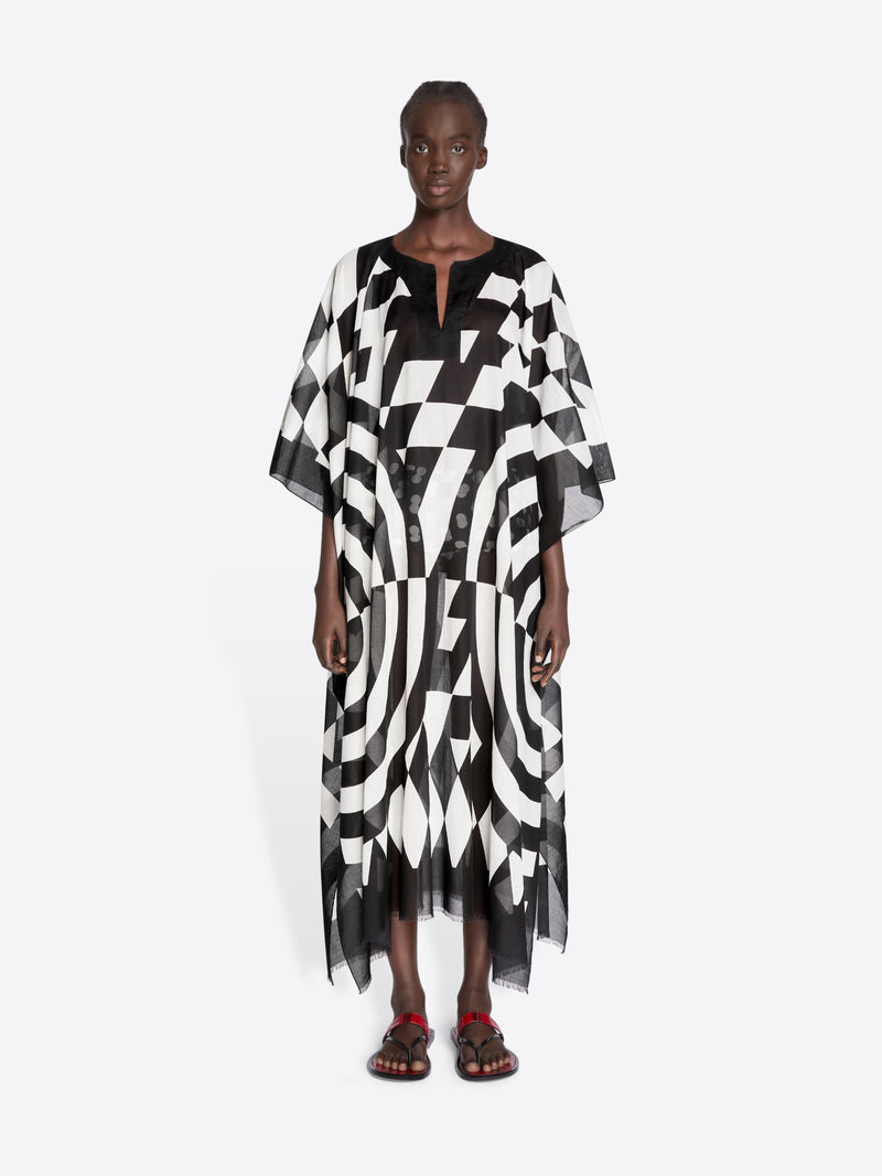 Model wearing a black and white patterned dress on a white background - Dries Van Noten