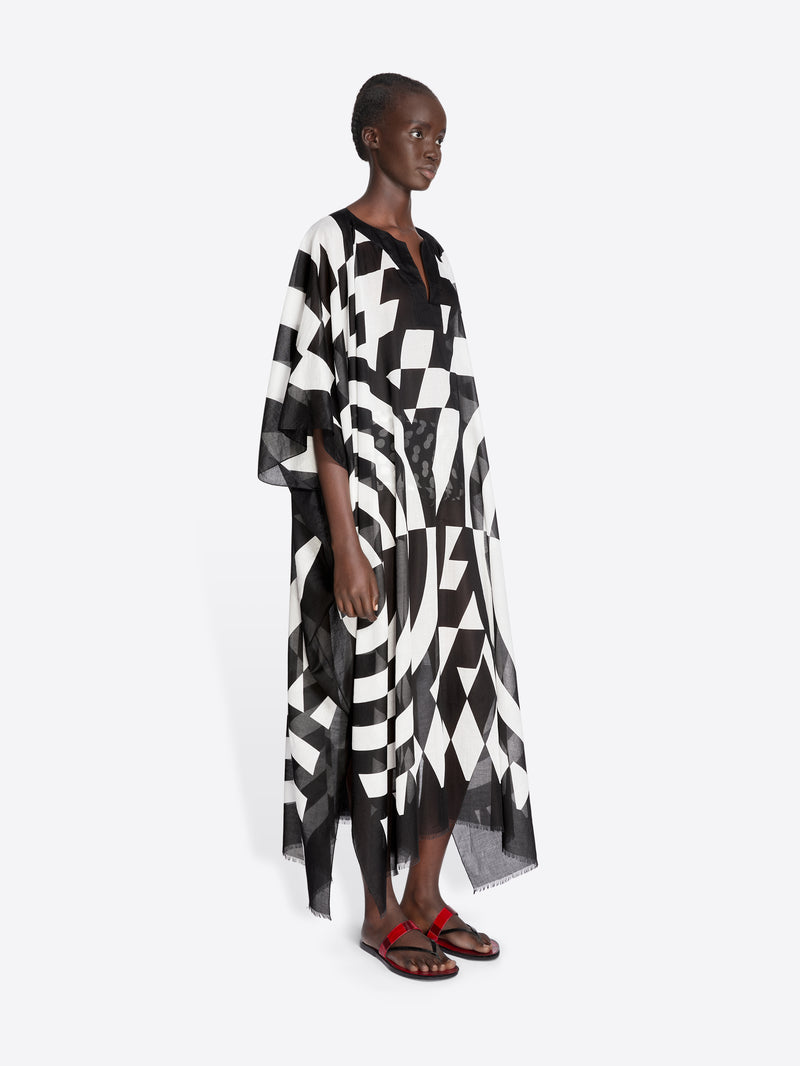 Woman wearing a black and white patterned dress on a white background - Dries Van Noten