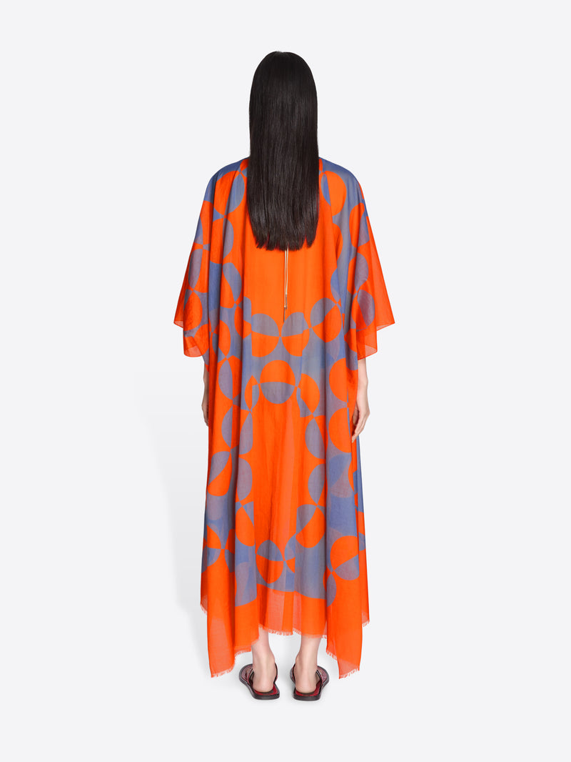 Woman wearing an orange and gray patterned dress on a white background - Dries Van Noten