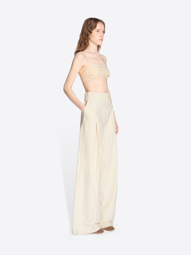 Woman wearing a light-colored dress on a white background - Dries Van Noten