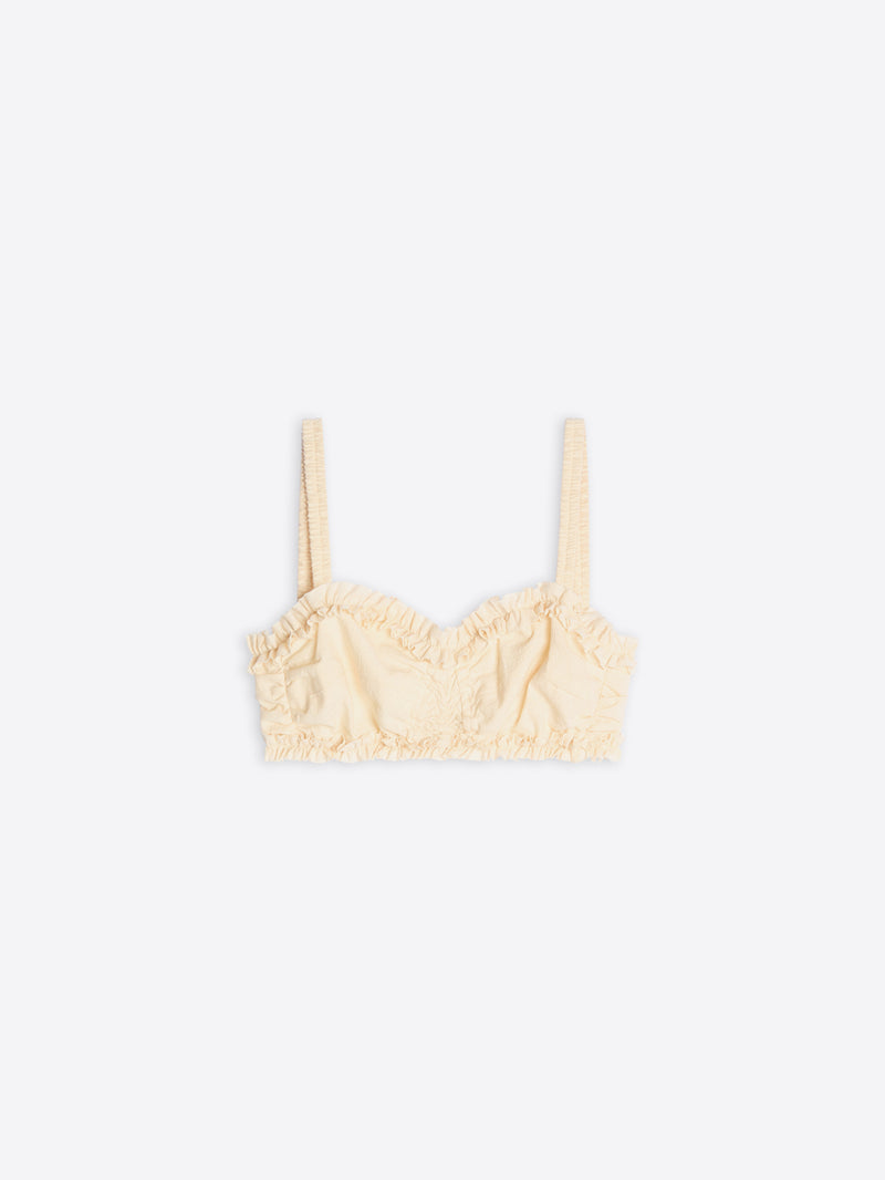 Cream-colored bralette with lace details on a white background - Dries Van Noten