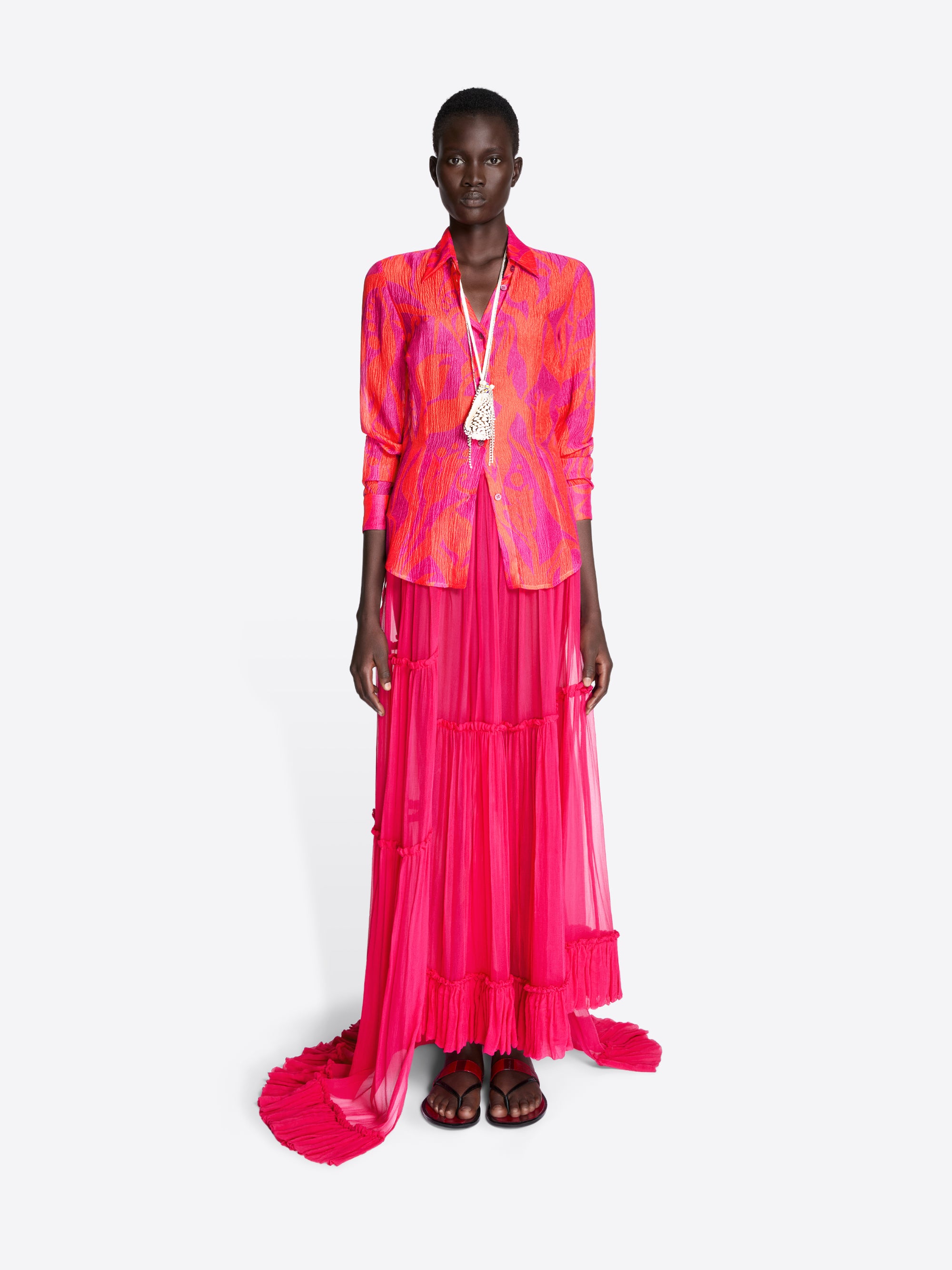 Model wearing a vibrant pink and orange outfit on a white background - Dries Van Noten