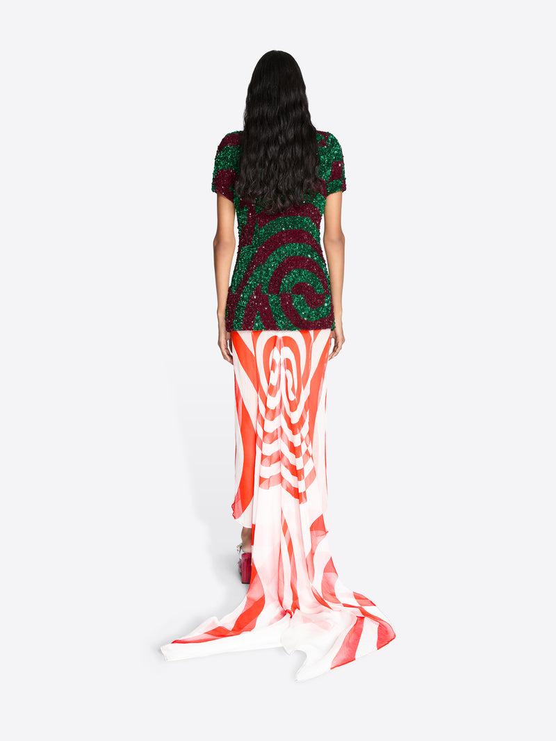 Woman wearing a long, colorful set with a white background - Dries Van Noten