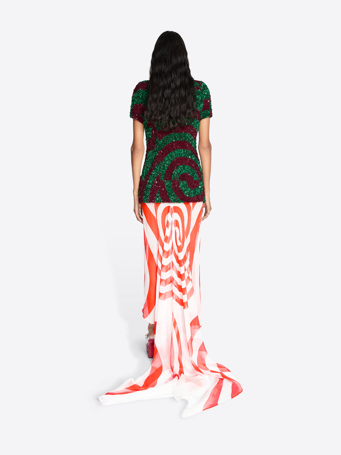Woman wearing a long, colorful set with a white background - Dries Van Noten